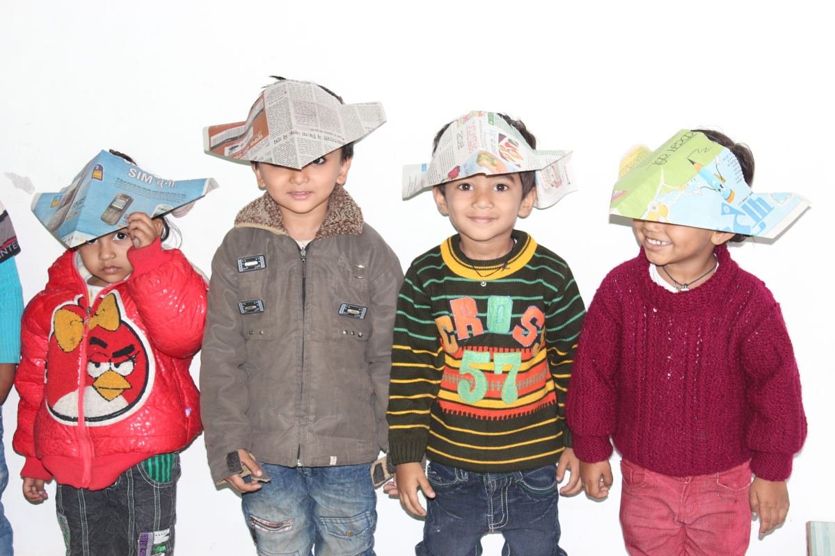 Children in paper hats