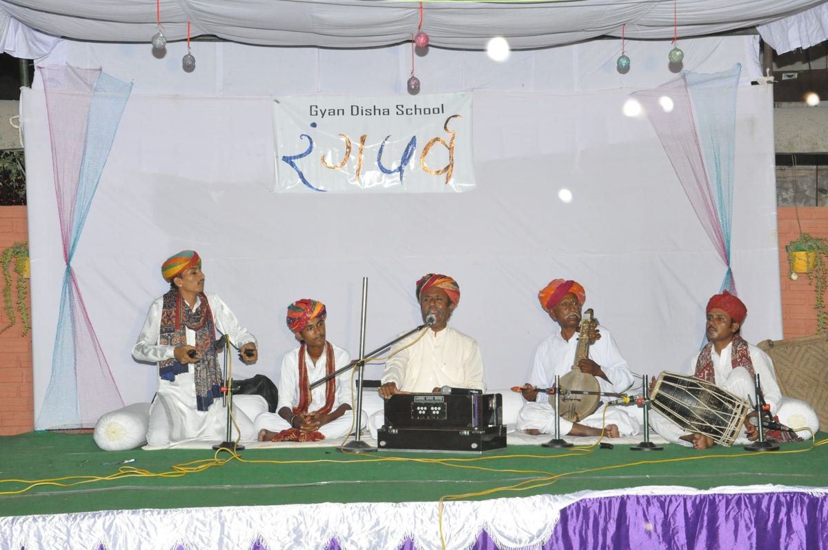 Musicians performing on the school stage