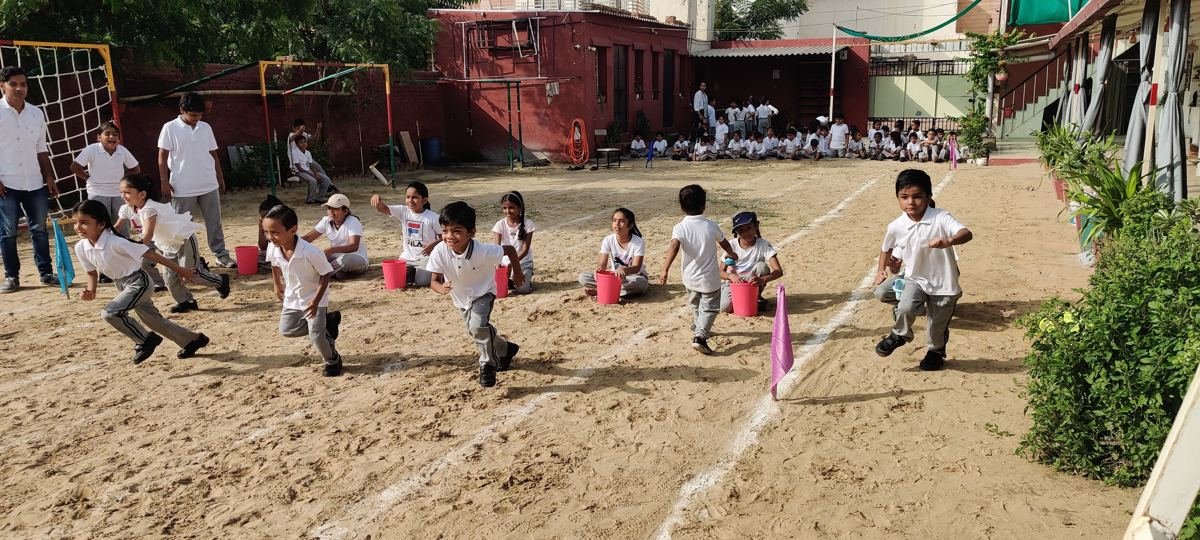 Children playing a running game in the yard